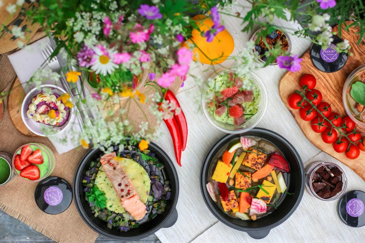 Flatlay of anti-inflammatory foods including salmon, walnuts, berries, and leafy greens