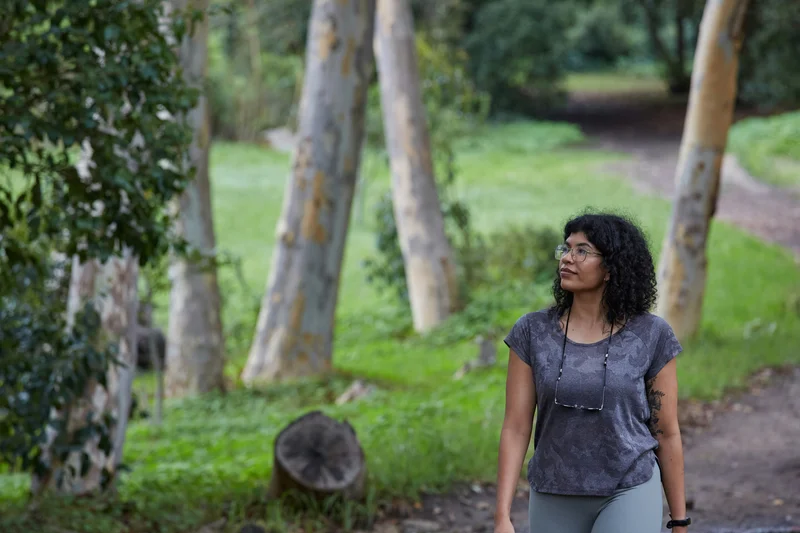 Woman walking in nature as daily movement habit