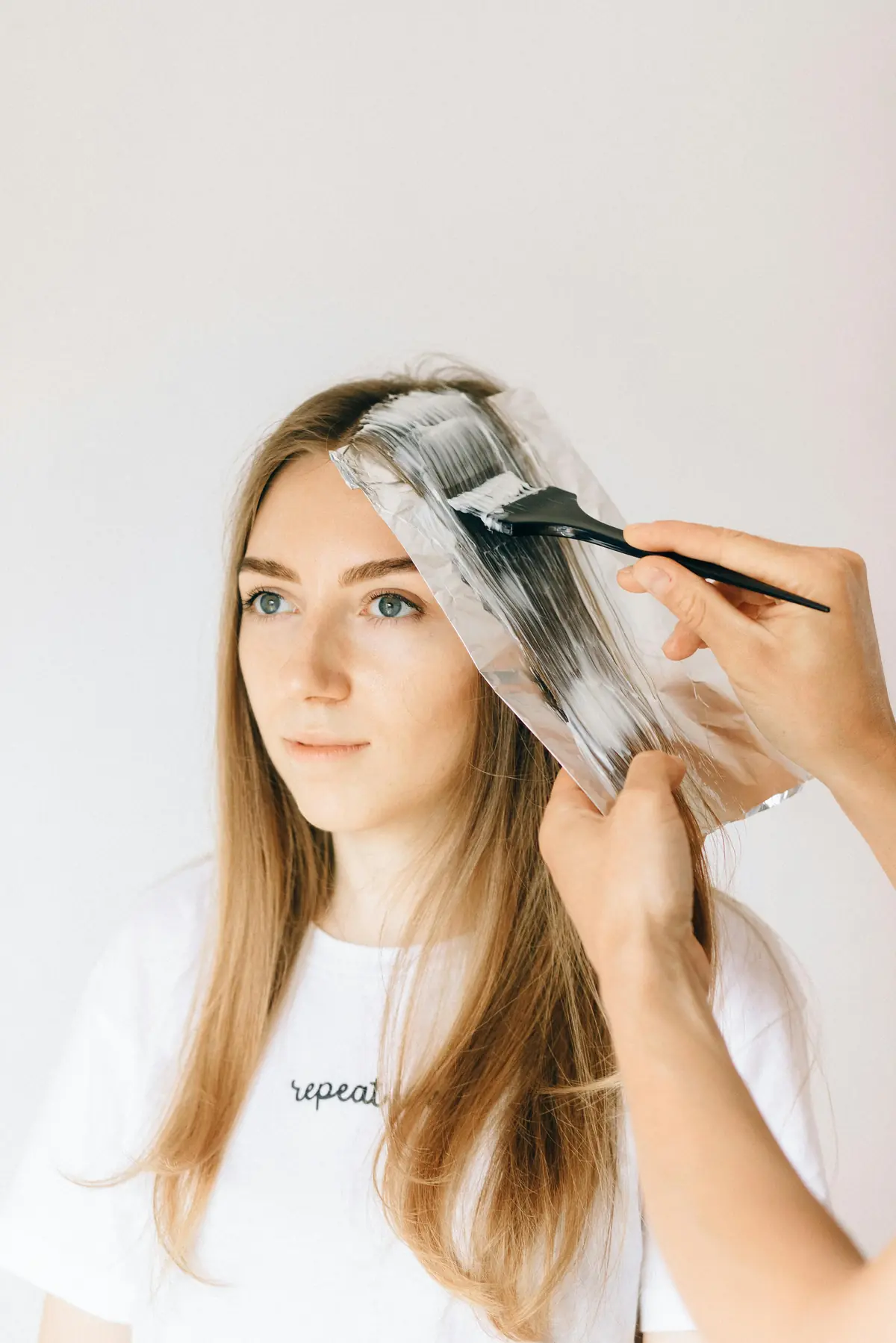 Hair dye application showing the chemical process of coloring hair