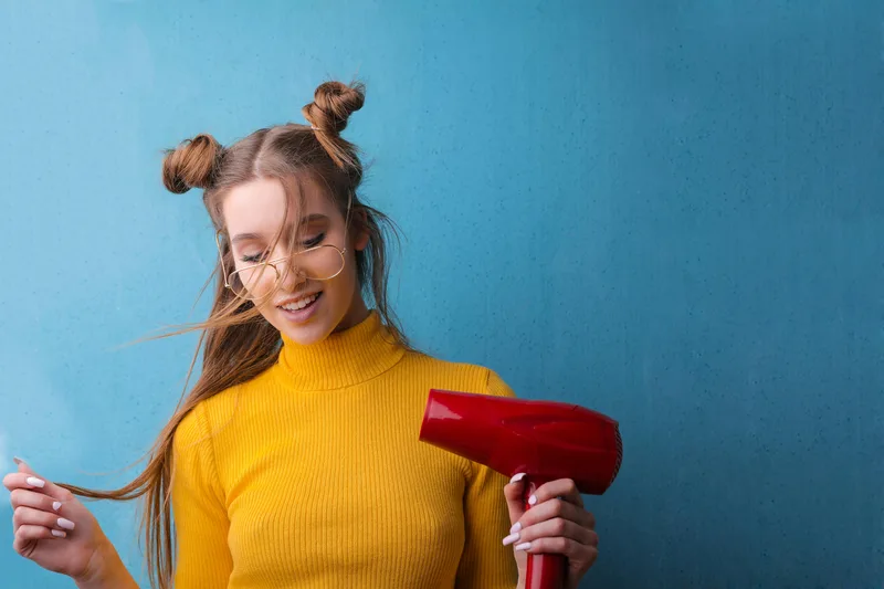 Heat styling tool being used on hair